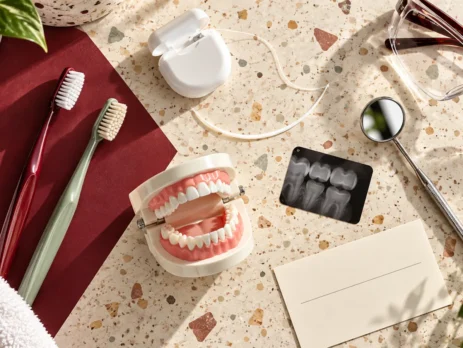 Preventive dental care items including toothbrushes, floss, a dental model, mirror and X-ray