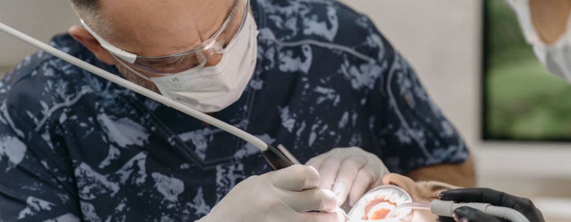 Dental professional providing care to a patient.