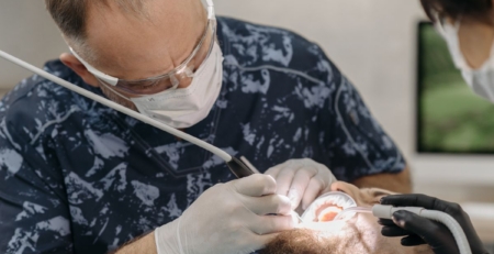 Dental professional providing care to a patient.