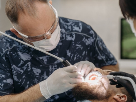 Dental professional providing care to a patient.