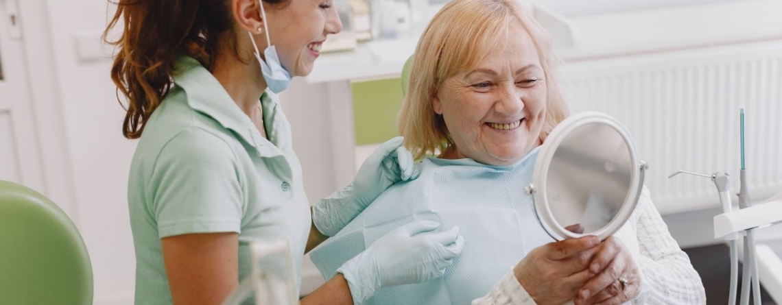 Dentist speaking with a patient during a consultation.