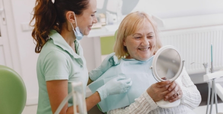 Dentist speaking with a patient during a consultation.